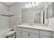Bathroom with a modern vanity, large mirror, and tiled shower/tub combo at 2432 Golden Pasture Cir, Clearwater, FL 33764