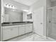 Elegant bathroom with double vanity, modern lighting, and contemporary finishes for a luxurious feel at 2432 Golden Pasture Cir, Clearwater, FL 33764