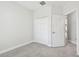 Neutral bedroom with carpeted floors, a double door closet, and a light-filled atmosphere at 2432 Golden Pasture Cir, Clearwater, FL 33764
