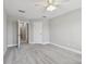 Spacious bedroom with neutral carpet, ceiling fan and bathroom access at 2432 Golden Pasture Cir, Clearwater, FL 33764