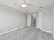 Bedroom with neutral carpet, ceiling fan and ensuite bathroom at 2432 Golden Pasture Cir, Clearwater, FL 33764