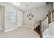 Inviting entryway showcasing a staircase and light-filled space at 2432 Golden Pasture Cir, Clearwater, FL 33764