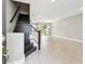 Bright entryway featuring wood-look tile flooring and a staircase at 2432 Golden Pasture Cir, Clearwater, FL 33764