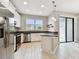 Modern kitchen with stainless steel appliances and sliding glass doors to backyard at 2432 Golden Pasture Cir, Clearwater, FL 33764