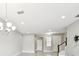 Bright living room featuring modern flooring and open floor plan at 2432 Golden Pasture Cir, Clearwater, FL 33764