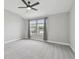 This main bedroom is bright with large windows and modern light fixtures at 2432 Golden Pasture Cir, Clearwater, FL 33764