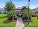 View of the community pool area through the pavilion entrance, showcasing its inviting atmosphere at 2432 Golden Pasture Cir, Clearwater, FL 33764