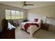 Bright bedroom with large window offering natural light and peaceful views at 2541 Laurelwood Dr # 8C, Clearwater, FL 33763
