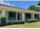 Inviting single story villa with green framed windows and manicured shrubs at 2541 Laurelwood Dr # 8C, Clearwater, FL 33763