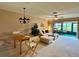 Cozy living room with dining area featuring neutral tones and lots of natural light at 2541 Laurelwood Dr # 8C, Clearwater, FL 33763
