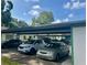 Carport parking area with multiple cars parked underneath, offering convenient and covered parking spaces at 2541 Laurelwood Dr # 8C, Clearwater, FL 33763