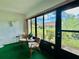 Relaxing sunroom with comfortable seating and views of the lush backyard at 2541 Laurelwood Dr # 8C, Clearwater, FL 33763