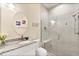Modern bathroom featuring granite vanity, glass enclosed shower with seat at 26 Concord Dr, Dunedin, FL 34698