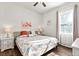Bedroom with a bed, two side tables and a large window at 26 Concord Dr, Dunedin, FL 34698
