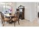 Dining room featuring a wooden table, decorative hutch, and window with pink curtains at 26 Concord Dr, Dunedin, FL 34698