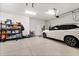 Spacious garage with a clean epoxy floor and ample space for parking and storage at 26 Concord Dr, Dunedin, FL 34698