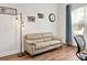 Cozy living room featuring modern furniture and a hardwood floor at 26 Concord Dr, Dunedin, FL 34698