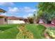 Beautiful lawn with garden space with flowering foliage, mature plants and trees at 2728 Abbey Grove Dr, Valrico, FL 33594