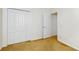 Bedroom with neutral carpet, a closet with bi-fold doors, and a door at 2728 Abbey Grove Dr, Valrico, FL 33594