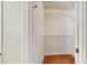 Walk-in closet featuring wood floors and built-in shelving for storage at 2728 Abbey Grove Dr, Valrico, FL 33594