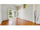 Spacious living room boasts hardwood floors and sliding glass doors to backyard at 2728 Abbey Grove Dr, Valrico, FL 33594