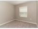 Cozy bedroom with carpet flooring, natural light and neutral paint at 2801 Midnight Pearl Dr, Sarasota, FL 34240