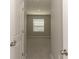 View from the doorway into the bedroom that features neutral walls and carpet flooring at 2801 Midnight Pearl Dr, Sarasota, FL 34240