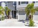 Charming two-story townhome with well-maintained landscaping and a one-car garage at 2801 Midnight Pearl Dr, Sarasota, FL 34240