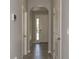 Hallway with tile flooring leading to the front door at 2801 Midnight Pearl Dr, Sarasota, FL 34240