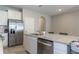 Kitchen with a stainless steel refrigerator, and white cabinets at 2801 Midnight Pearl Dr, Sarasota, FL 34240