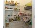 Walk-in pantry featuring wire shelves and ample storage space at 2801 Midnight Pearl Dr, Sarasota, FL 34240