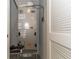 Utility closet housing a modern HVAC system and a white louvered door at 2801 Midnight Pearl Dr, Sarasota, FL 34240