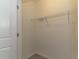 A walk-in closet with carpet flooring and a single wire shelf for storage at 2801 Midnight Pearl Dr, Sarasota, FL 34240