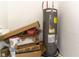 Utility area featuring a water heater and some household storage boxes at 2801 Midnight Pearl Dr, Sarasota, FL 34240