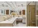 Large bathroom with dual sinks and a walk-in shower offers luxury and convenience at 3401 Pinon Dr, Holiday, FL 34691
