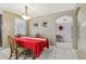 Dining room showing tile floors, a dining set, and artwork on the walls at 3401 Pinon Dr, Holiday, FL 34691