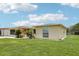Lovely single-story home featuring mature landscaping, a courtyard, and well-maintained exteriors in a quiet neighborhood at 3401 Pinon Dr, Holiday, FL 34691