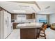 An open kitchen features bright light from the skylight and views into the living room at 3401 Pinon Dr, Holiday, FL 34691