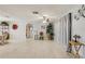 Inviting living room featuring tiled flooring, neutral paint, ceiling fan, and ample space, ideal for both relaxation and gatherings at 3401 Pinon Dr, Holiday, FL 34691