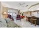 Open floor plan with a living room, dining area, and breakfast bar, perfect for entertaining guests at 3401 Pinon Dr, Holiday, FL 34691