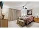 This bedroom features a ceiling fan, curtains, and dual nightstands at 3401 Pinon Dr, Holiday, FL 34691