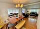 Inviting dining area showcasing natural light and an open layout adjacent to the living room at 34091 Alamanda N Dr, Pinellas Park, FL 33781