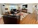 Cozy living room with comfortable seating, a stylish rug, and an entertainment center at 34091 Alamanda N Dr, Pinellas Park, FL 33781