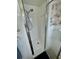 Walk-in shower featuring white tile, chrome hardware and a shower head at 34091 Alamanda N Dr, Pinellas Park, FL 33781