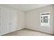 Bedroom features carpeted floor and window with a view at 3448 Yellow Leaf Cir, Spring Hill, FL 34609