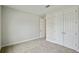 Empty bedroom features double closets and carpet at 3448 Yellow Leaf Cir, Spring Hill, FL 34609