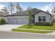 Lovely single-Gathering home with stone accents and a well-maintained lawn at 3448 Yellow Leaf Cir, Spring Hill, FL 34609