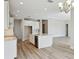Bright, modern kitchen featuring a center island and sleek white cabinetry at 3448 Yellow Leaf Cir, Spring Hill, FL 34609