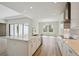 Modern kitchen with a large island, stainless steel appliances, and an open floor plan at 3448 Yellow Leaf Cir, Spring Hill, FL 34609