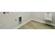 Laundry room with vinyl wood floor and sink at 3448 Yellow Leaf Cir, Spring Hill, FL 34609